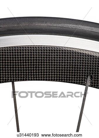 Drawing - Carbon fibre bicycle wheel, close up.. Fotosearch