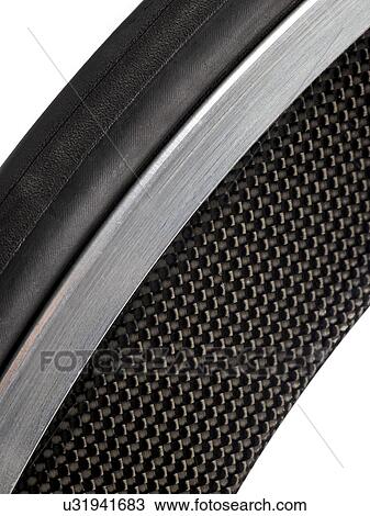 Drawing - Carbon fibre bicycle wheel, close up.. Fotosearch
