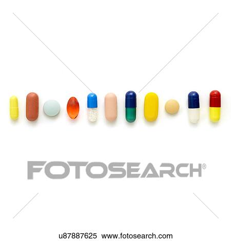 Stock Illustration - Coloured capsules and tablets against a white background.. Fotosearch