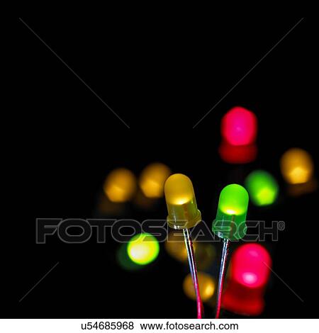 Coloured light emitting diodes (LEDs) against a black background. View Large Illustration Stock Illustration - Coloured light emitting diodes (LEDs) against a black background.. Fotosearch