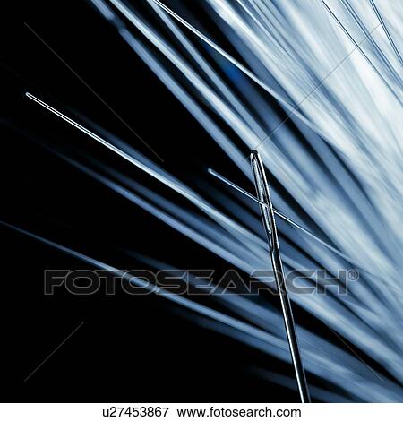 Fibre optic being thread through a needle, close up. View Large Illustration Stock Illustration - Fibre optic being thread through a needle, close up.. Fotosearch