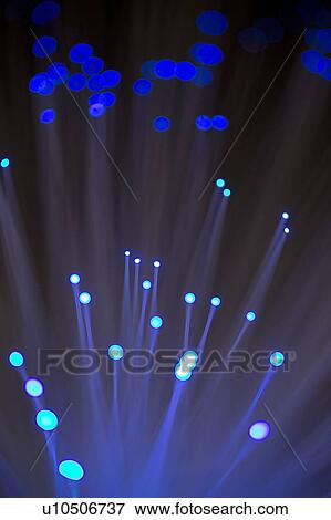 Stock Illustration - Fibre optics against a black background.. Fotosearch