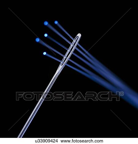 Stock Illustration - Fibre optics being thread through a needle, close up.. Fotosearch