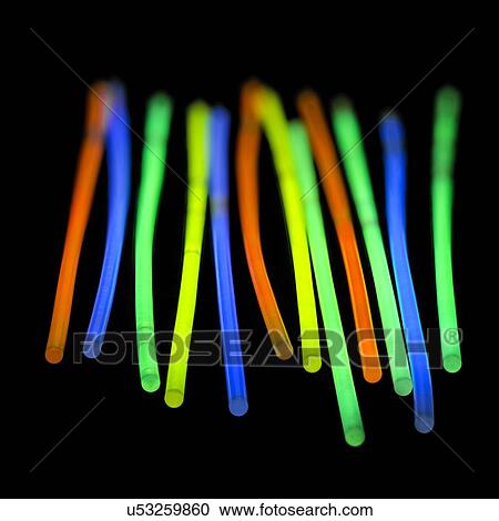 Glow sticks against a black background. View Large Illustration Clipart - Glow sticks against a black background.. Fotosearch