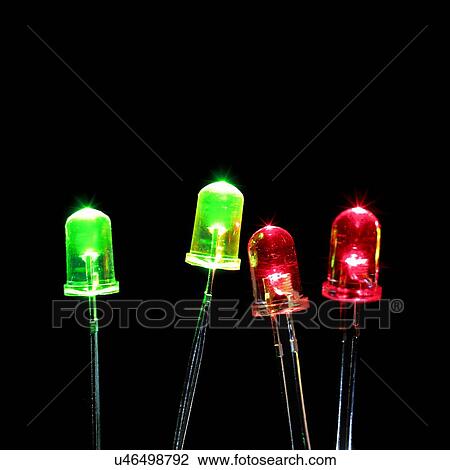 Green and red light emitting diodes (LEDs) against a black background. View Large Illustration Drawing - Green and red light emitting diodes (LEDs) against a black background.. Fotosearch