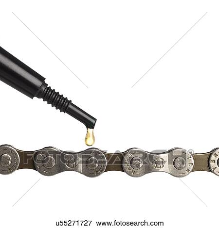 Stock Illustration - Lubricant oil dripping onto a bicycle chain, close up.. Fotosearch