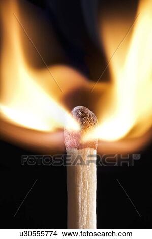 Stock Illustration - Matchstick on fire against a black background.. Fotosearch