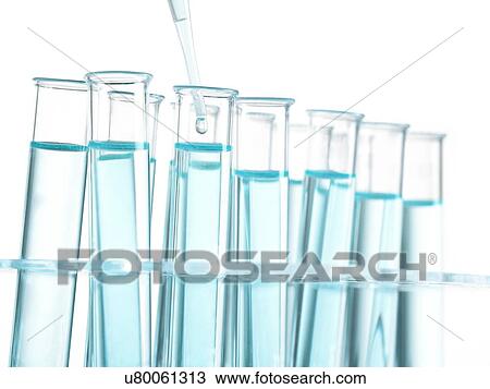 Drawing - Pipette dripping liquid into test tubes in a rack.. Fotosearch