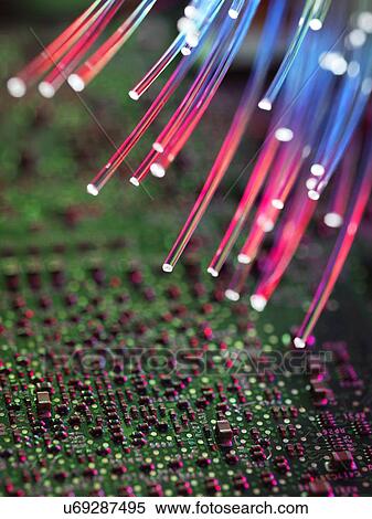 PROPERTY RELEASED. Fibre optics carrying data passing a computer circuit board. View Large Illustration Stock Illustration - PROPERTY RELEASED. Fibre optics carrying data passing a computer circuit board.. Fotosearch