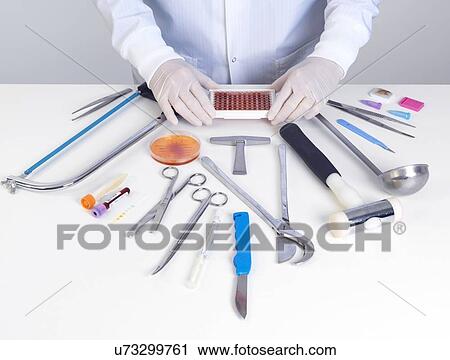 PROPERTY RELEASED. MODEL RELEASED. Pathologist about to perform a autopsy with his surgical equipment and tests for medical and forensic analysis. View Large Photo Image Stock Image - PROPERTY RELEASED. MODEL RELEASED. Pathologist about to perform a autopsy with his surgical equipment and tests for medical and forensic analysis.. Fotosearch