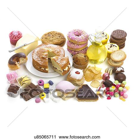 Selection of sweet foods and confectionary against a white background. View Large Illustration Clip Art - Selection of sweet foods and confectionary against a white background.. Fotosearch