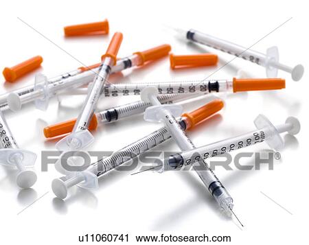 Clip Art - Syringes against a white background.. Fotosearch