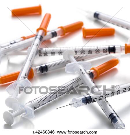 Syringes against a white background. View Large Illustration Stock Illustration - Syringes against a white background.. Fotosearch