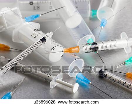 Syringes and needles, close up. View Large Illustration Stock Illustration - Syringes and needles, close up.. Fotosearch