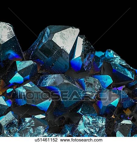 Titanium quartz against a black background. These quartz crystals have been coated with titanium to make them iridescent. View Large Illustration Drawing - Titanium quartz against a black background. These quartz crystals have been coated with titanium to make them iridescent.. Fotosearch
