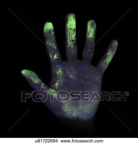 Stock Illustration - Ultraviolet light showing bacteria on a person's hand.. Fotosearch