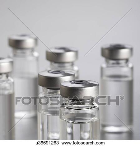 Drawing - Vaccine vials, close up.. Fotosearch