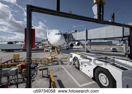 A380 aircraft and tug at stand at airport View Large Photo Image Stock Photo - A380 aircraft and tug at stand at airport. Fotosearch