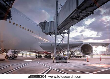 A380 aircraft on stand at airport at sunset View Large Photo Image Picture - A380 aircraft on stand at airport at sunset. Fotosearch
