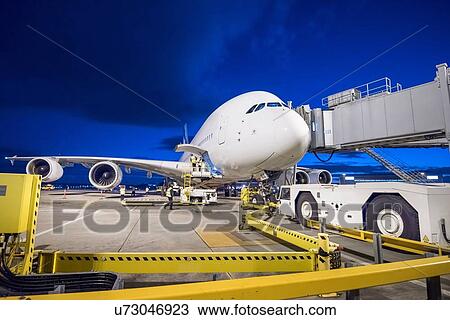 A380 aircraft on stand at airport at night View Large Photo Image Stock Image - A380 aircraft on stand at airport at night. Fotosearch