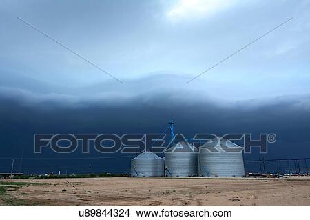Picture - Arcus cloud from storm over grain silos, Dalhart, Texas, USA. Fotosearch