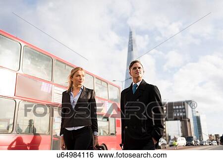 Businessman and businesswoman on business trip, London, UK View Large Photo Image Stock Photograph - Businessman and businesswoman on business trip, London, UK. Fotosearch