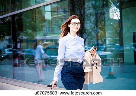 Businesswoman outside glass building View Large Photo Image Stock Image - Businesswoman outside glass building. Fotosearch