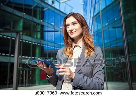 Businesswoman using digital tablet View Large Photo Image Stock Photo - Businesswoman using digital tablet. Fotosearch