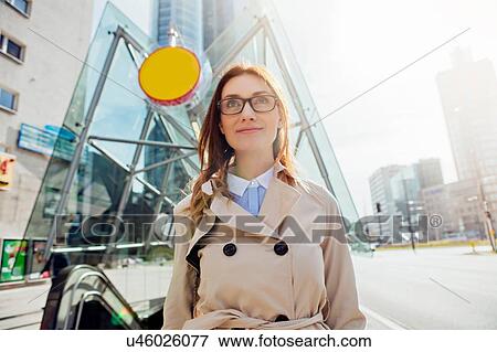 Stock Photo - Businesswoman wearing glasses, smiling. Fotosearch
