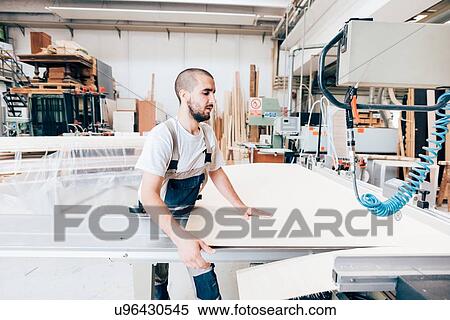 Stock Photography - Carpenter at work. Fotosearch