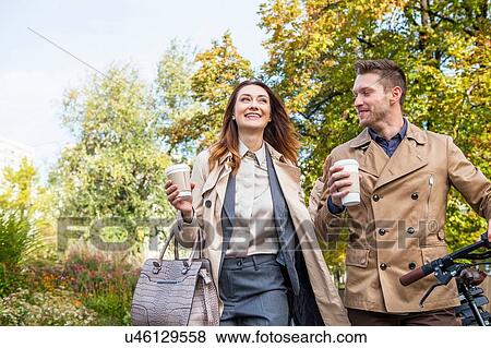 Casual businessman and woman with coffee View Large Photo Image Stock Photo - Casual businessman and woman with coffee. Fotosearch