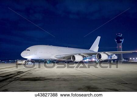 Chief engineer with A380 aircraft on runway at night View Large Photo Image Stock Photo - Chief engineer with A380 aircraft on runway at night. Fotosearch