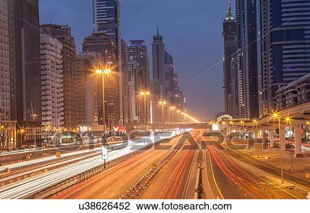 City highway and Dubai metro rail station at night, downtown Dubai, United Arab Emirates View Large Photo Image Stock Image - City highway and Dubai metro rail station at night, downtown Dubai, United Arab Emirates. Fotosearch