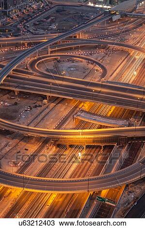 Stock Image - City highways and flyovers at night, downtown Dubai, United Arab Emirates. Fotosearch