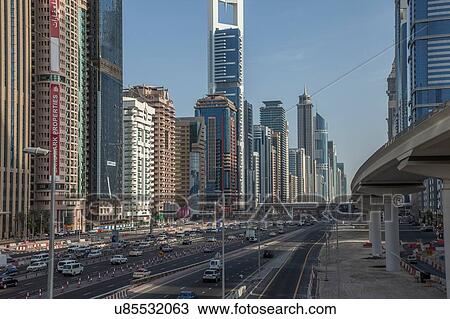 City skyline and Sheikh Zayed Road, downtown Dubai, United Arab Emirates View Large Photo Image Stock Image - City skyline and Sheikh Zayed Road, downtown Dubai, United Arab Emirates. Fotosearch
