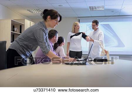 Designers in meeting about orthopaedic sling View Large Photo Image Stock Image - Designers in meeting about orthopaedic sling. Fotosearch