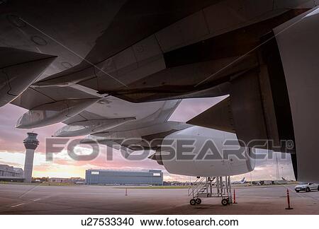 Detail of A380 aircraft at airport at sunset View Large Photo Image Stock Image - Detail of A380 aircraft at airport at sunset. Fotosearch