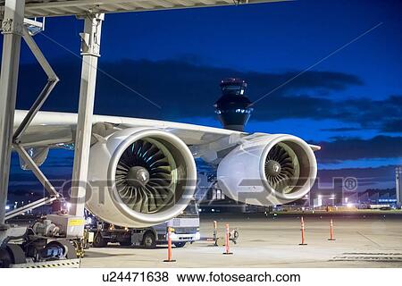 Stock Photo - Detail view of A380 aircraft engine at night. Fotosearch
