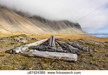 Discarded fence posts on beach, Stokksnes, Iceland View Large Photo Image Stock Photography - Discarded fence posts on beach, Stokksnes, Iceland. Fotosearch