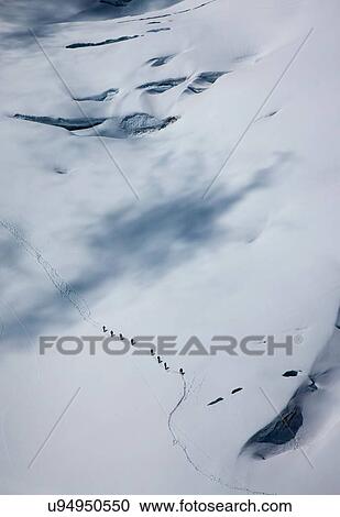 Distant high angle view of climbing team crossing glacier at Mont Blanc, Chamonix, Haute Savoie, France View Large Photo Image Stock Image - Distant high angle view of climbing team crossing glacier at Mont Blanc, Chamonix, Haute Savoie, France. Fotosearch