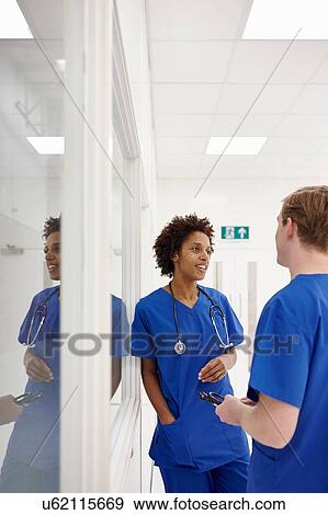 Doctor having discussion in hospital View Large Photo Image Stock Photo - Doctor having discussion in hospital. Fotosearch