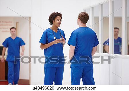 Doctors having discussion in hospital View Large Photo Image Stock Image - Doctors having discussion in hospital. Fotosearch
