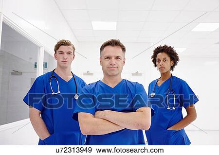 Doctors posing in hospital View Large Photo Image Stock Photo - Doctors posing in hospital. Fotosearch