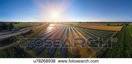 Elevated panoramic landscape with rows of solar panels, Bavaria, Germany View Large Photo Image Stock Photo - Elevated panoramic landscape with rows of solar panels, Bavaria, Germany. Fotosearch