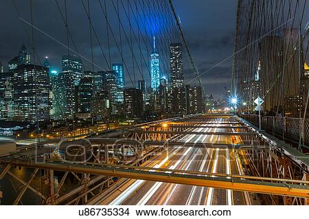 Elevated view of Brooklyn bridge and Manhattan financial district skyline at night, New York, USA View Large Photo Image Picture - Elevated view of Brooklyn bridge and Manhattan financial district skyline at night, New York, USA. Fotosearch