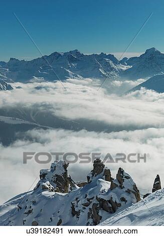 Stock Image - Elevated view of low cloud in Swiss Alps valley, Berner Oberland, Switzerland. Fotosearch