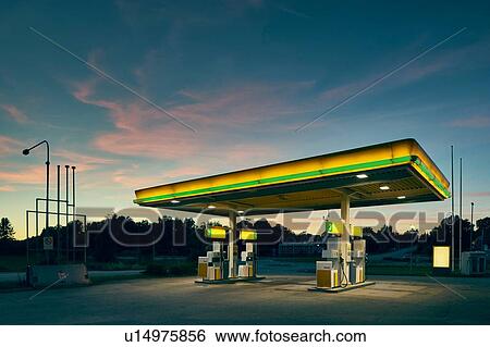 Stock Photograph - Empty gas station at dusk, Kalmar, Sweden. Fotosearch