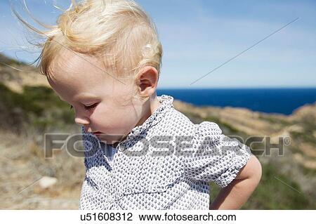 Female toddler looking down at coast, Calvi, Corsica, France View Large Photo Image Stock Image - Female toddler looking down at coast, Calvi, Corsica, France. Fotosearch