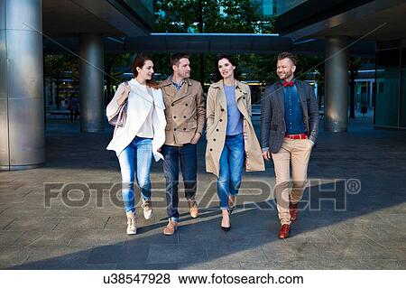 Four mid adult friends walking together View Large Photo Image Stock Photo - Four mid adult friends walking together. Fotosearch