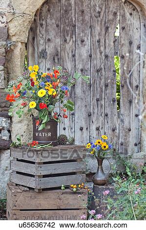 Fresh flowers in pot, on wooden crate View Large Photo Image Stock Image - Fresh flowers in pot, on wooden crate. Fotosearch